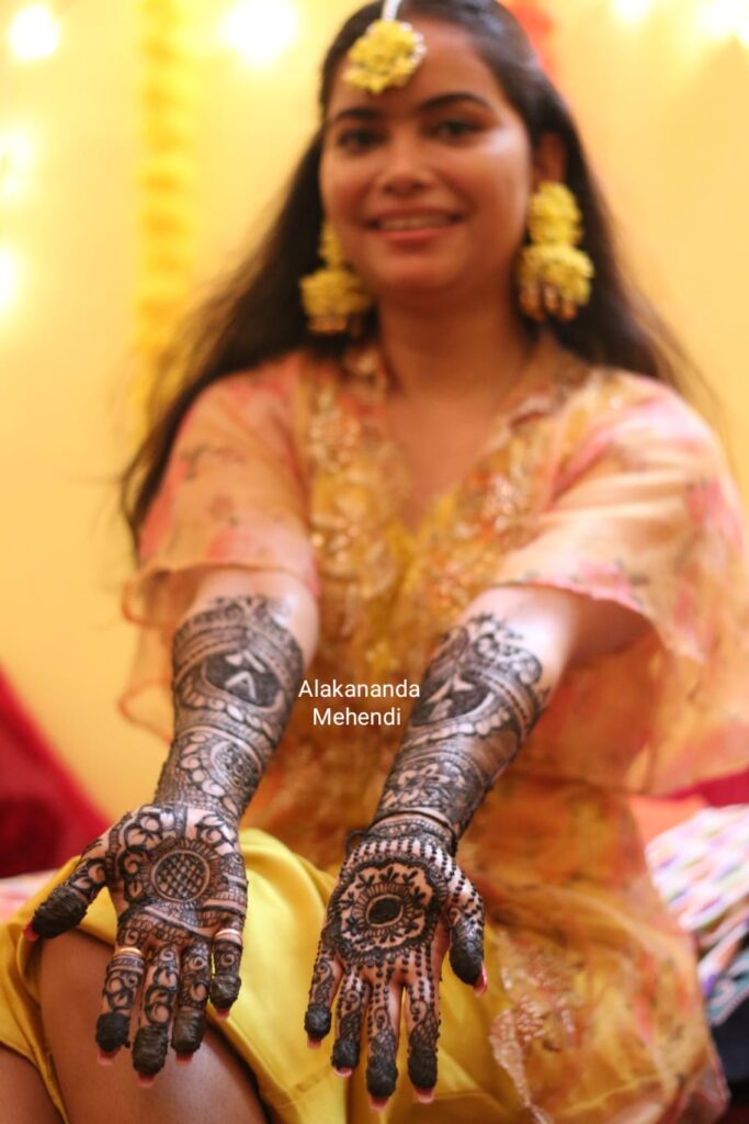 Bridal mehndi design for hands and feet.