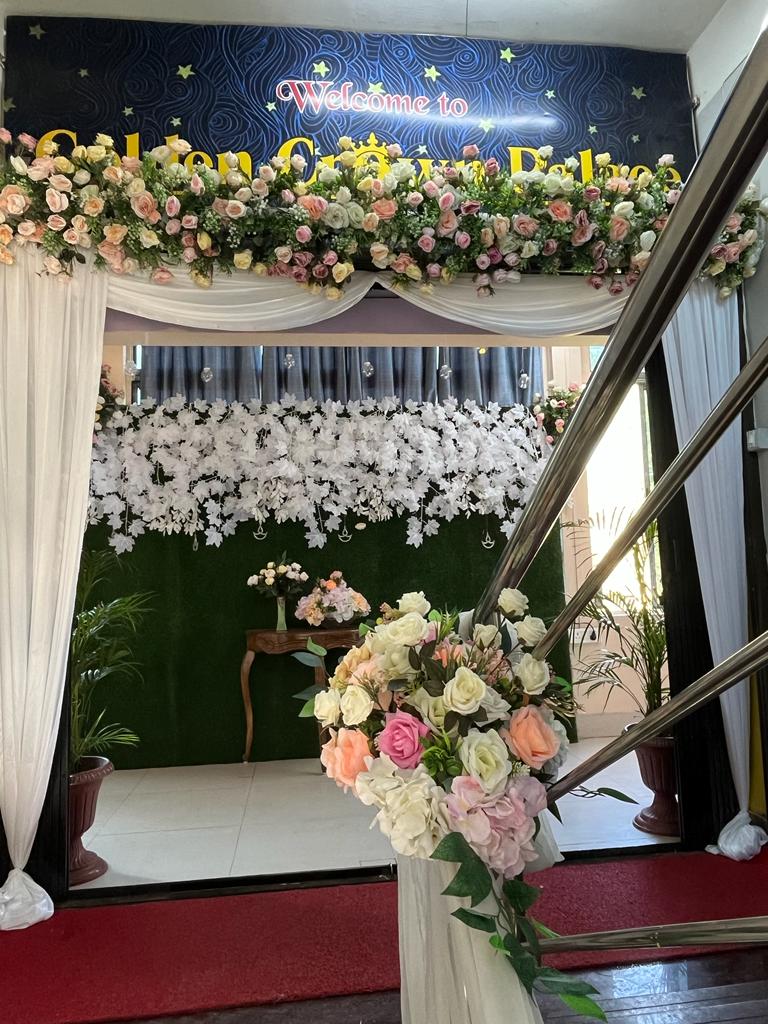 Entrance adorned with flower decoration.