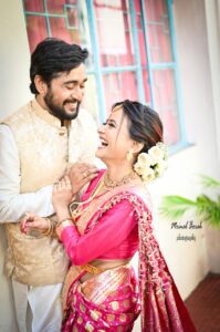 Couple smiling happily while looking at each other.