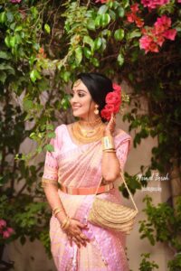 Girl striking a pose for a photograph.