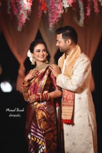 A smiling couple looking at each other.