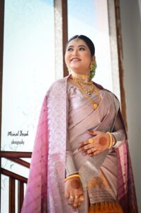 A smiling girl wearing a mekhela chador in Guwahati.