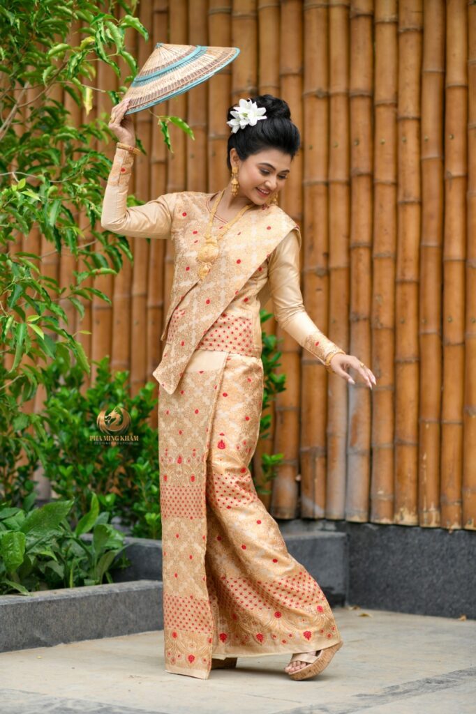 Assamese girl striking a pose for a photograph.