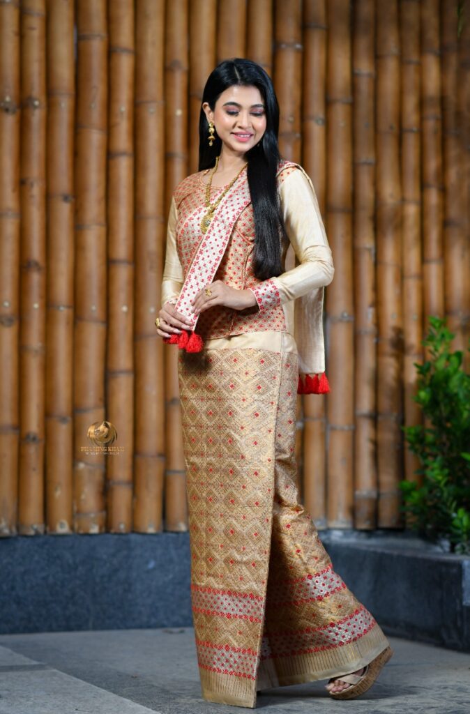 Assamese girl wearing a creatively styled saree.
