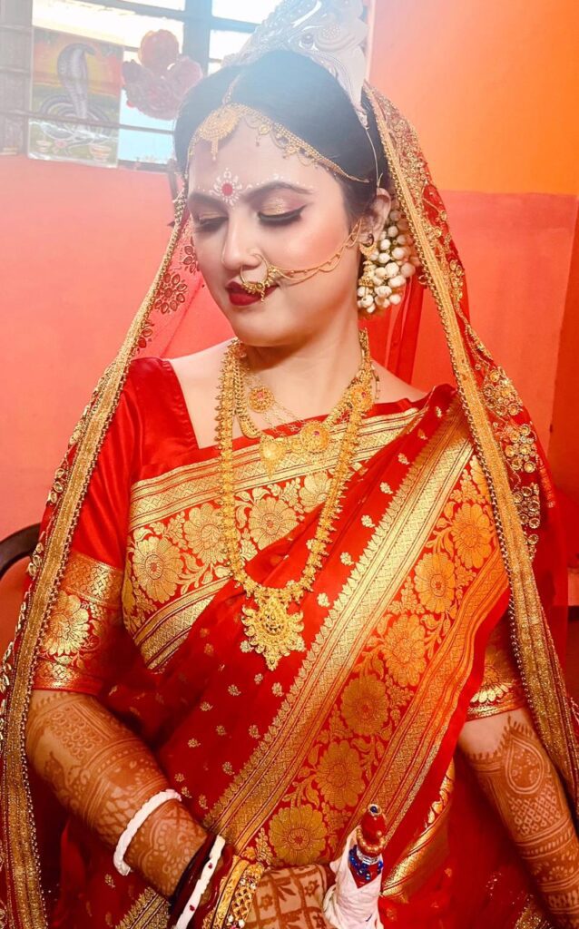 Bride's makeup done by Pooja Bora.