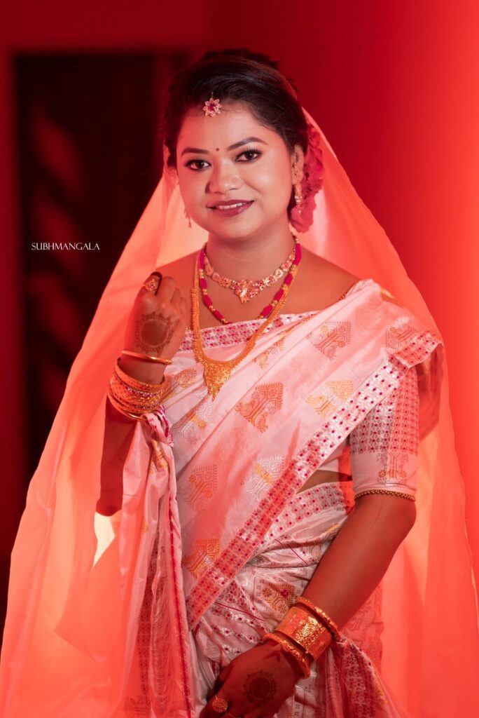 Assamese girl wearing a sari in traditional style.
