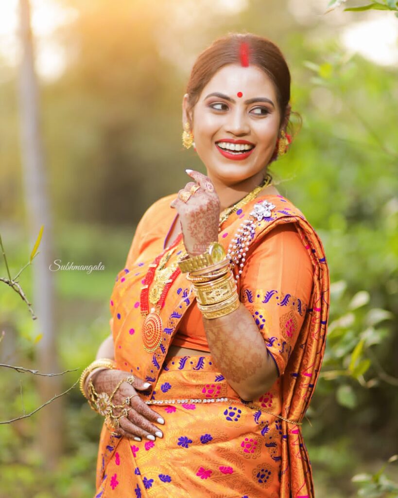 Assamese girl smiling joyfully.