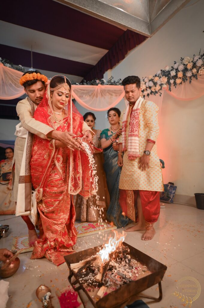 Bride and groom performing mandap rituals.