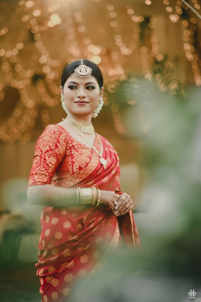 Girl wearing a red saree.