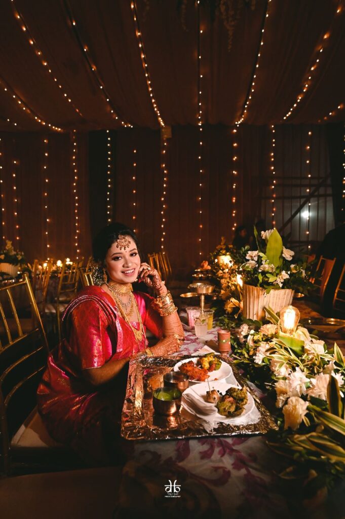 Girl is sitting on a dining table.