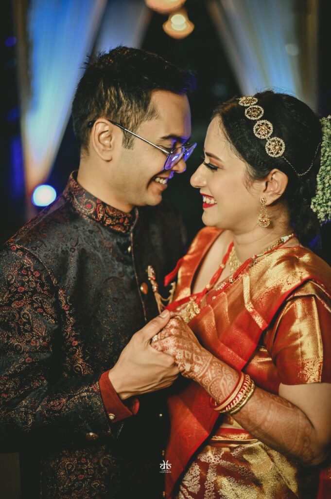 A couple laughing while looking at each other.