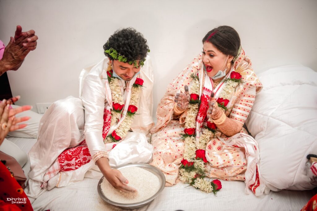 Bride and groom performing wedding rituals.