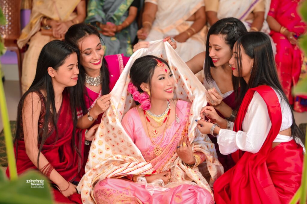 Bride smiling joyfully with her friends.