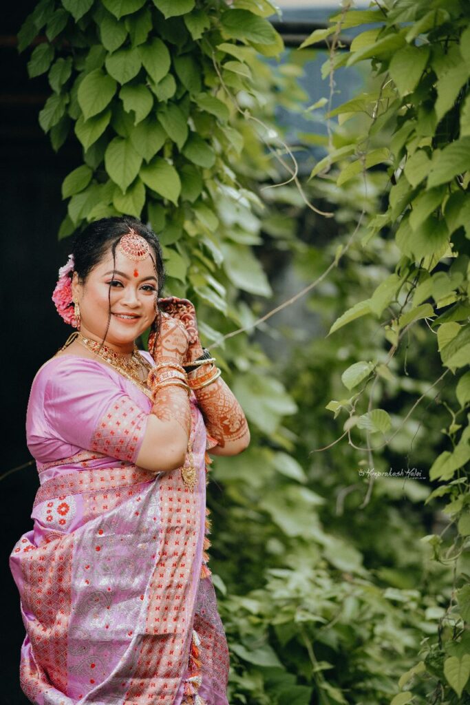 A bride giving pose for her photograph.