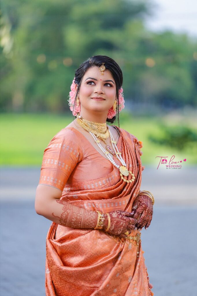 Assamese girl striking a pose for a photograph.