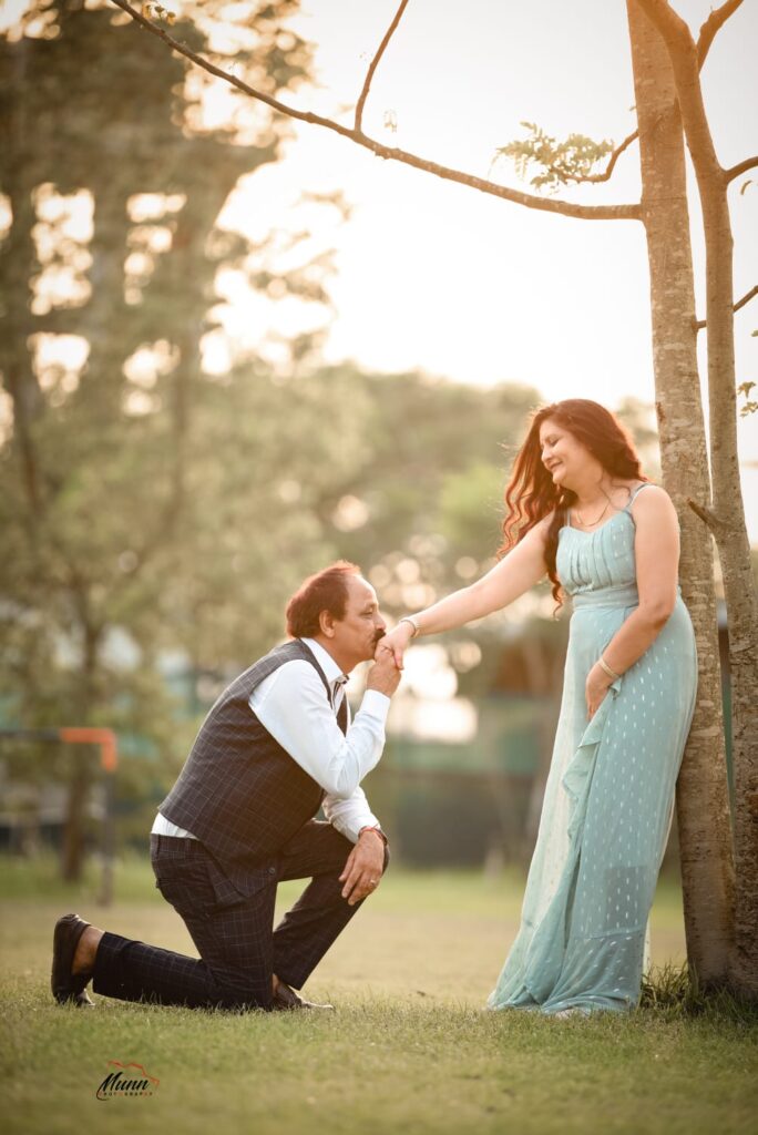 Husband kisses on her wife's hand.