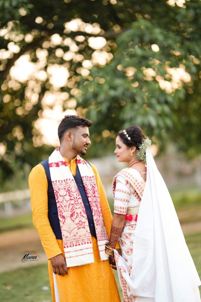Couple striking a pose while looking at each other.