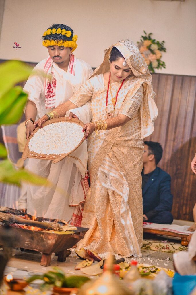 Bridal and groom performing wedding rituals.