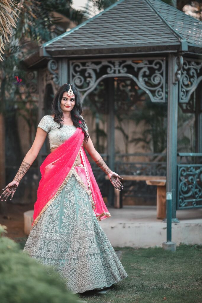 Girl twirling in a lehenga choli outfit."