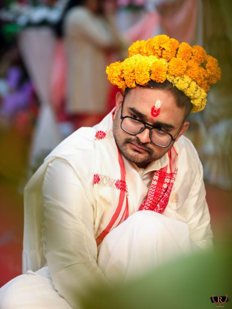 Groom dressed up in a traditional wedding attire.