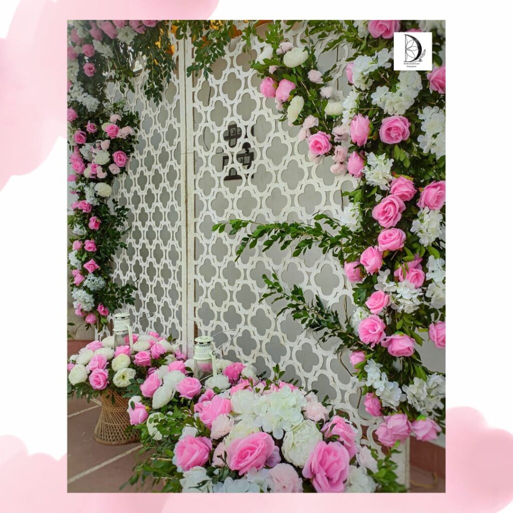 Door decoration from white and pink flowers