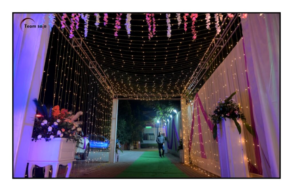 Entrance decorated with lights and flowers