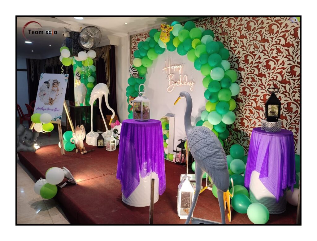 Birthday stage decorated with green balloons