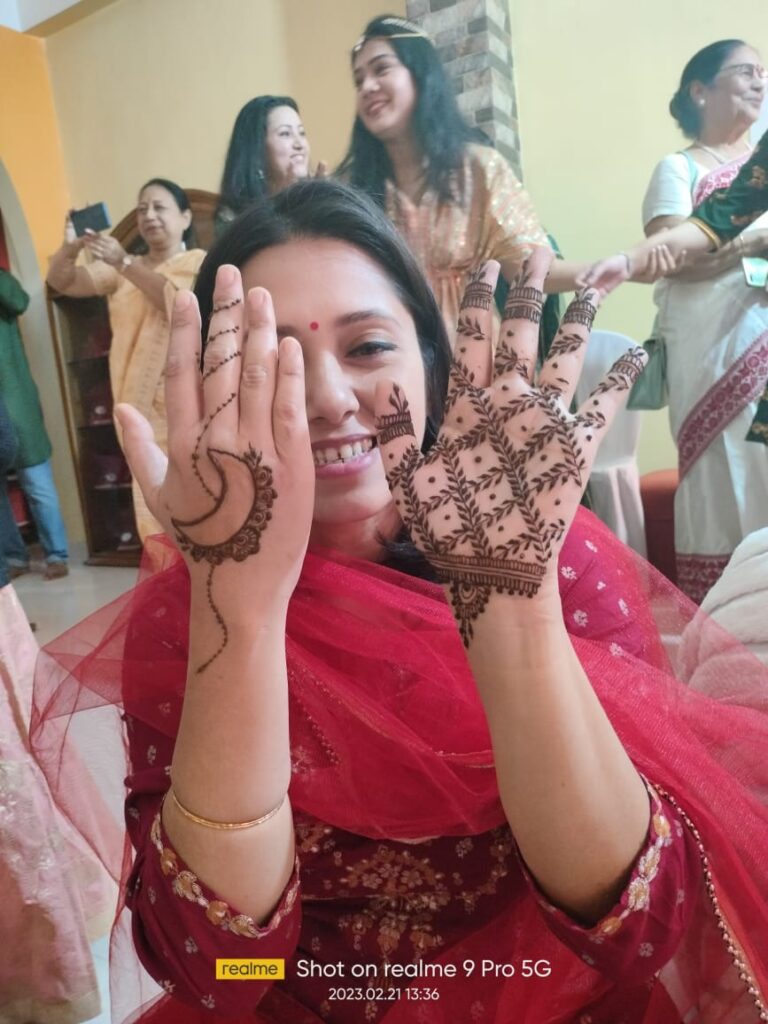Girl showing her mehndi designs for hands.