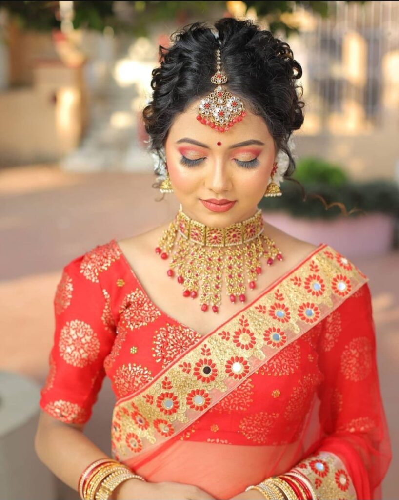 Bride's makeup done by Sangita Kalita.