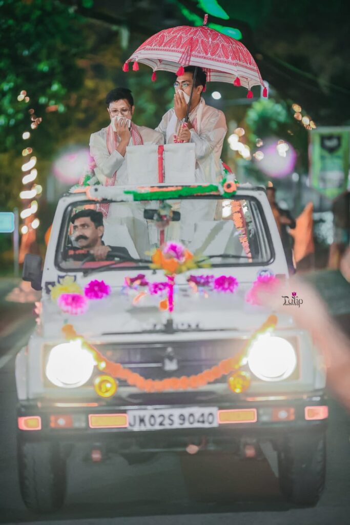 Arrival of a groom in a decorated car.